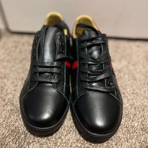 Gucci tennis shoes. Size 8.5, Black, red, Gold, and navy blue